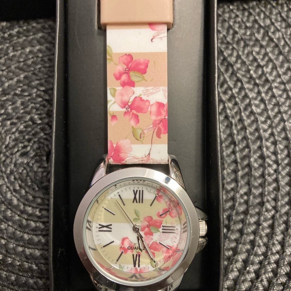 Avon women’s watch. Pretty Floral stripe watch. New, never used.